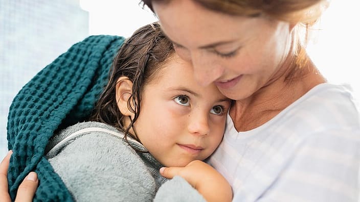 mother holding child